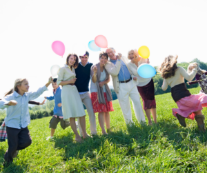 family reunion outside at a park with Balloons.