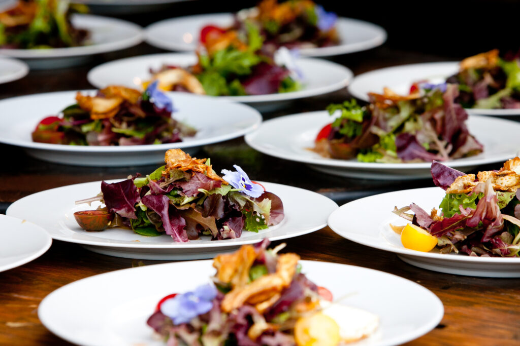 Catering spread with individual salads prepared for a catered event