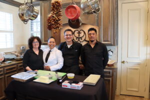 The Cater Dallas team posing for a photo at a catered event in Dallas, TX.