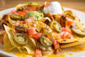 a plate of nachos from el chico catering
