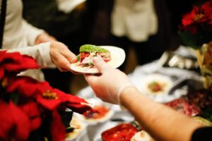 Server handing food to a guest