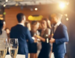 A shot of a holiday formal event with a mix of women and men talking in the back