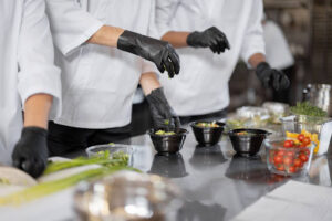 Chefs preparing meal for catering event