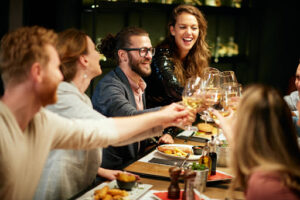 A group of people smiling and celebrating a holiday